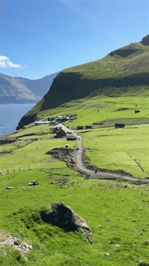 clip-4034144429-trollanes-village-view-fjord-neighboring-island-kalsoy