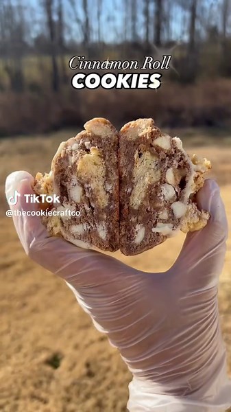 Our bestselling Cinnamon Roll Cookies are made with a cinnamon spiced cookie dough base, stuffed with REAL cinnamon rolls and loaded with white chocolate chips!🍪🤎 • • • #gourmetcookies #cinnamonroll #baker #stuffedcookies #bakery