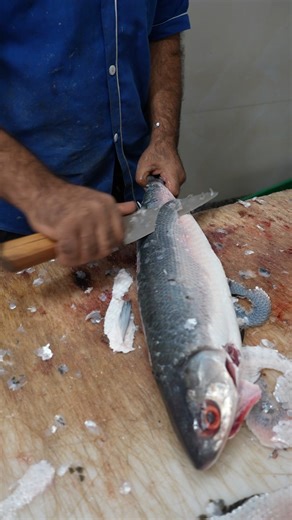 Watch an Expert Fish Monger Remove Skin Flawlessly