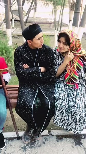 Engaging Outdoor Conversation in Stylish Outfits