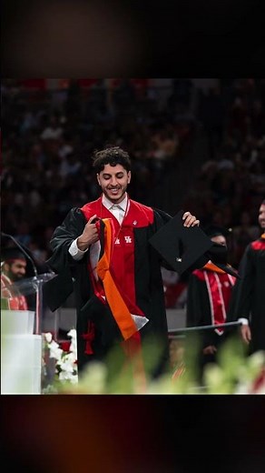 College Student Backflips at Graduation
