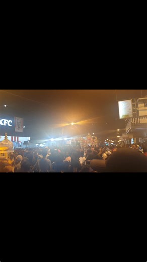 A large crowd lines the Western Main Road in St. James for Big Hosay 2025. | TTT Live Online