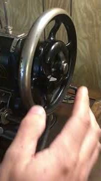 White rotary electric sewing machine hand wheel