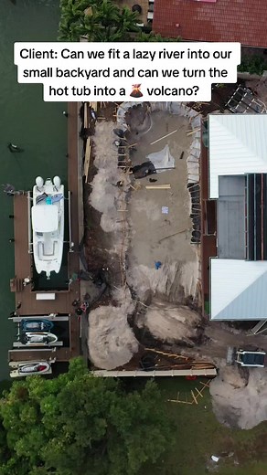 Client: Can we fit a lazy river into our small backyard and can we turn the hot tub into a 🌋 volcano? We collaborated with @poseidonpools to make this backyard a reality. #volcano #lazyriver #lazyriverpool #poolbuilders #construction #pool #builder