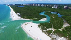 8.2K views · 197 reactions | Clam Pass Park is tucked away behind the Naples Grande Beach Resort, at the end of Seagate Drive. The park boasts 35 acres of coastal habitat and preserves. A free tram service carries beachgoers over a 3/4-mile boardwalk to the white sandy beach. The boardwalk is a destination in itself for those who love a quiet nature walk. Learn more about Clam Pass Park at: https://www.colliergov.net/index.aspx?page=458 | Southwest Florida Television | Facebook