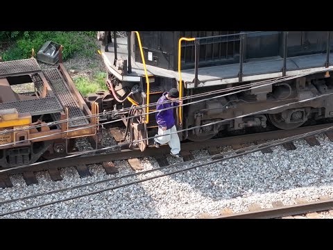 Lunatic Walking Tracks Stops a Stack and Climbs On and CP Leading a CSX Freight Meets an NS Freight