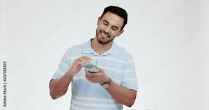 Happy, face and man with money rain in studio for cashback, investment or growth on white background. Bills, smile and cash prize, award or bonus for model with financial freedom, poker or bingo