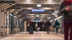 Time lapse people moving at train station. Timelapse with blurred women and men bustling in busy subway. Time-lapse crowds, walking traffic in city with blur effect.