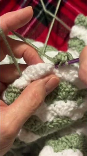 Mom crocheting the shell stitch Double