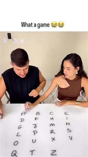 @funcreakers on Instagram: "The video depicts a Brazilian couple humorously struggling to draw a continuous line connecting the Portuguese alphabet’s 23 letters (A-Z excluding K, W, Y) on a whiteboard grid without lifting the marker or crossing lines, succeeding after multiple failed attempts. - This puzzle, a variant of the “house, tree, bridge” Eulerian path challenge, becomes solvable with Portuguese’s reduced letter count—unlike English’s 26 letters, which often require an odd-degree vertex 
