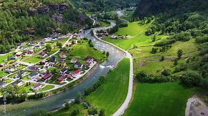 Norway. Flam. Beautiful views of the village of Flam. Waterfall, river, mountains are incredibly beautiful views from the drone. Video 4k