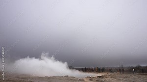 Powerful geyser eruptions captivate spectators. Jets of steam and water create dramatic spectacles over rugged terrain. Geysers, Iceland.