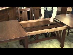 Self-storing leaves in trestle table