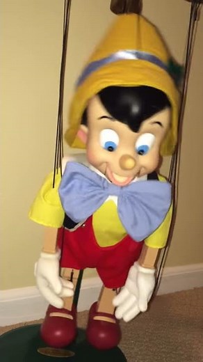Disney's Pinocchio marionette puppet dances and sings