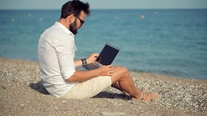 Freelance On Sea. Distance Work And Checking Email.Mobile Worker Software Developer Job. Freelancer Chatting On Laptop. Businessman Internet Online Meeting Webinar. Remote Working Internet On Vacation