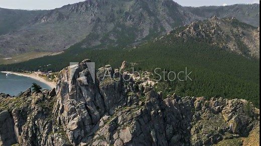 Beautiful scenic views of summer Lake Baikal from a bird's-eye view. Wildlife of the lake and rocks on a sunny day
