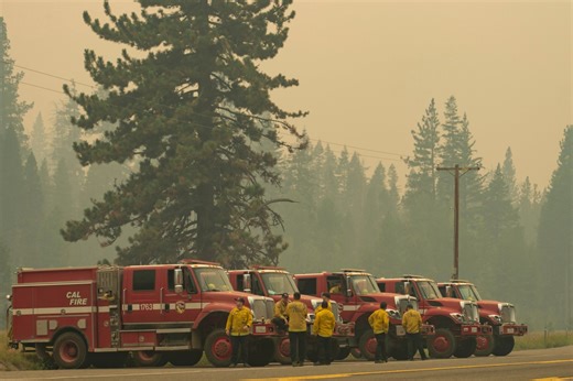 California firefighters battle a dozen large wildfires