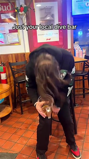 Yes he is drinking the beer from the pitcher #fyp #divebar #birds