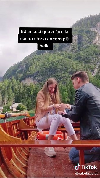 Romantic Boat Proposal Under Mountainous Skies