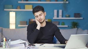 Stressed busy businessman tired and exhausted. Businessman working long hours about work at home gets tired and depressed.
