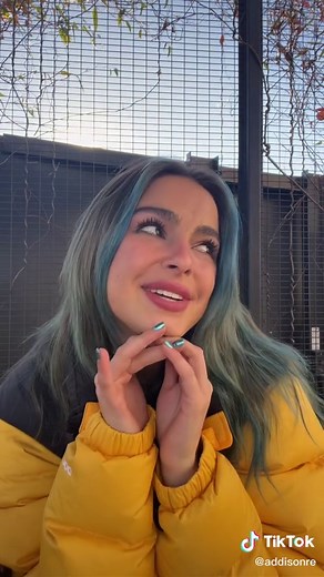 Long Wavy Hair with Blue Highlights in Outdoor Setting