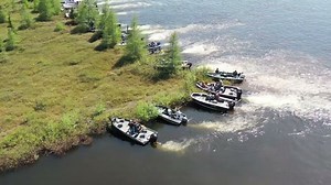 Boats join forces to move giant bog.