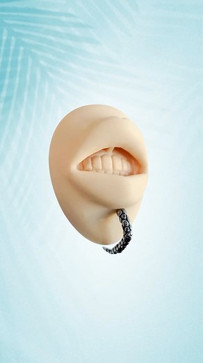 Have you ever seen this piercing? The “disturbed labret” chin piercing is the ultimate, unique, alt piercing! It’s a real head-turner and conversation-starter that you should wear to your next concert or party! #altpiercings #alternative #altmodels #labretpiercing #facialpiercings #piercinginspo #styleinspired #fashioninspo | BodyJewelry.com