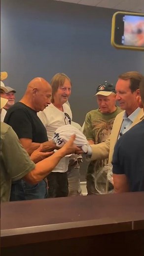 Gov. Jeff Landry speaks with fishermen before signing seafood labeling bill into law