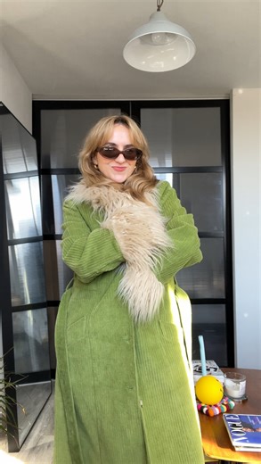carmen on Instagram: "Express yourself FULLY 🌟 —— VD: Carmen is a white blonde woman who’s showing her outfit indoors. She’s wearing black top and trousers, brown sunglasses and shoes and a statement coat in green with beige collar and cuffs. There is some text on screen that says “In your 20s you’ll be scared to wear certain clothes in fear of being told you’re “too much”. It’s very important you wear all those clothes.” #InYour20s #FashionGirl #FashionAdvice"