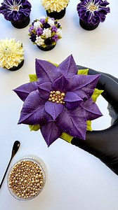 A sparkly purple buttercream poinsettia cupcake 💜🧁 #cupcakes #CupcakeInspo #cupcakeideas #cupcakeart #FloralCupcakes #buttercreamflowers #prettycupcakes #cakedecorating | Cakestone