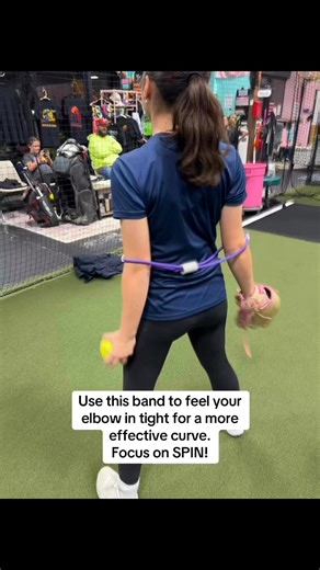 Use this band to feel your elbow coming in tight to produce a curve with more spin from the fingertips and wrist vs. “pulling” the ball. #curveball #pitchingdrills #pitcher #softballtraining #softballdrills #fastpitch #fastpitchsoftball #tipsandtricks #tips #sports #SoftballCommunity #softballcoach | Innovative Fastpitch