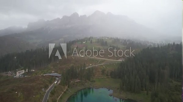 summer view of Lago di Carezza or Karersee alpine lake in the Dolomites in northeast Italy