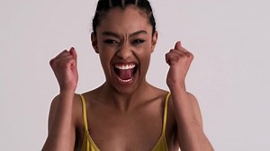 clip-1070039998-happy-woman-doing-winner-gesture-standing-isolated