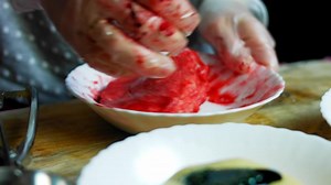 I draw lines with glaze at Mexican Sombrero cookies in three colors