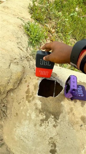 Jbl mini speakers throw in water pool for bass testing