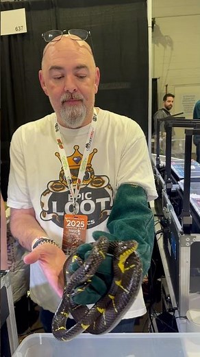 Matt Dillahunty handles a rear-fanged boiga.