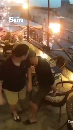 Terrifying moment balloons explode into fireball next to packed restaurant