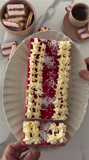 The recipe for this Iced VoVo Tart and other easy delicious desserts using your favourite bikkies can be found in the Arnott’s Cookbook! Grab your copy NOW from all good bookstores. ❤️ #arnottscookbook #arnotts #womensweekly | Arnott's Biscuits