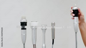 Close-up Medical device for radiofrequency lifting procedure. Face skin rejuvenation and anti-age at aesthetic cosmetology center. RF lifting in beauty clinic.