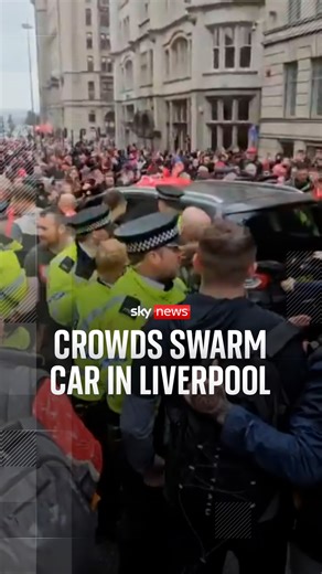 Footage shows the moments after a car ploughed into pedestrians in Liverpool - with crowds swarming around the car and hitting the windows as the police rush to respond. https://trib.al/ObO6hQf | Sky News