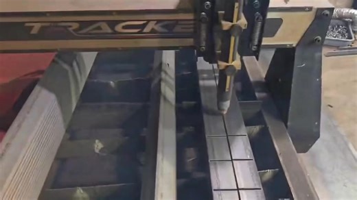 Blaine at the Fab Shop cutting angle iron. This is how a long job can be simpler, with a Tracker! Sometimes you need to think outside the box. | Tracker CNC