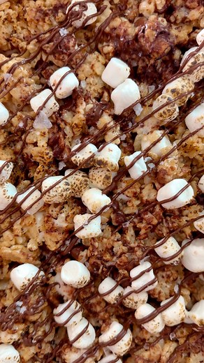 Magnolia Table on Instagram: "Enjoy sweet, chocolatey, and crunchy S’mores Marshmallow Squares. Try making them at home with the recipe below. ingredients + instructions ingredients: 6 cups crispy rice cereal 1 pound mini marshmallow 1 sleeve graham crackers, crushed into bite size pieces 1 stick unsalted butter ½ teaspoon kosher salt 1 teaspoon vanilla extract 1 ½ cups semi sweet chocolate chips 1 teaspoon flaky salt directions 1. Prepare a 9x13 inch baking pan with baking spray and line with p