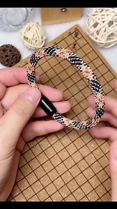 Burberry-inspired Kumihimo bracelet ✨ Classic black, beige, and red tones woven into a clean check-style pattern, finished with a sleek black clasp. ❤️🪢🖤 Crisp contrast, detailed texture, and an everyday wearable look—handcrafted from thread to final fit. #kumihimo #kumihimobraid #kumihimojewelry #kumihimobracelet #handmadejewelry #fiberart #braidingart #threadwork #textilecraft #craftreels #reelcraft #makersofinstagram #burberryinspired #checkpattern #neutraltones | Kumihimo
