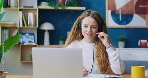 Customer service consultant, helping desk and advice with tech support and headset. Call-center and phone call, communication, talking with CRM, contact costumers and laptop at home office.