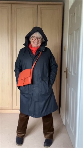 Vivienne Truran on Instagram: "Let it rain? So many people had asked to see the rubber mac! Here we go, it’s here with today’s outfit! Scarf, coat, glasses and a bag to make it all complete. #fashionista #grwm #ootd #coat #rain"