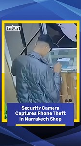 A security camera in Marrakech captured the moment a young man stole two phones from a local mobile store. The footage, shared online, shows the individual entering the shop and posing as a regular customer. After the shop owner handed him two phones to examine, the young man suddenly fled the store with the devices in hand. #morocco #world #news #marrakech #mwn #moroccoworldnews | Morocco World News