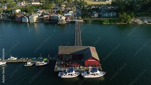 Aerial shot flying over the pier in Coupeville, WA to reveal the main street amenities.