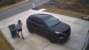 A couple returning home is caught off guard when their car begins to slip away on black ice. Watch the husband's lightning-fast reflexes as he looks like a winter superhero. | The Weather Network