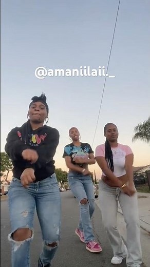 Three girls having fun doing the dances moves outside