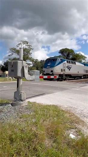 Amtrak train passing by with loud horn (archive)